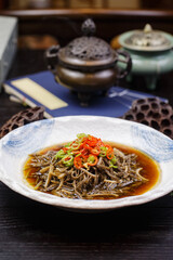 Shredded tripe in sour soup with pepper, sesame and red oil