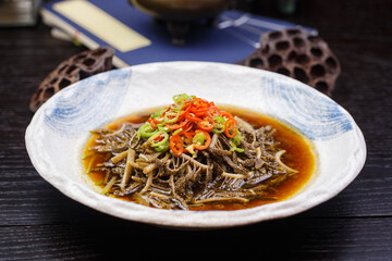 Shredded tripe in sour soup with pepper, sesame and red oil