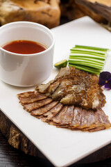 Braised pork belly and sausage with shredded cucumber