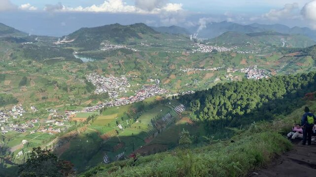 Mount Prau View, Indonesia, captured on July 3, 2025. A breathtaking highland scene with rolling hills, golden sunrise, and panoramic clouds above the peaks of Central Java.

