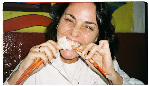 Woman Eating Crab Legs
