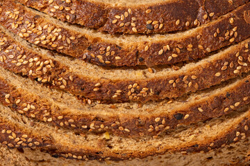 Close-up of freshly baked multigrain bread with sesame seeds on crust