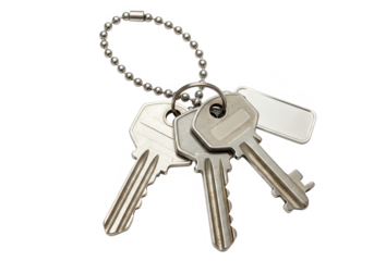 A set of three silver metal keys attached to a ball chain keychain and a blank tag, isolated on white