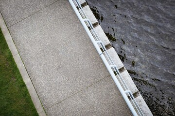 Obraz premium High angle view of empty footpath by lake