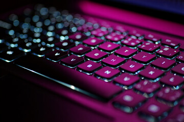 Close-up of a black laptop keyboard, highlighting keys and buttons for business and technology communication