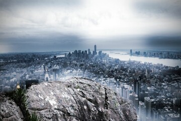 Large rock overlooking huge city