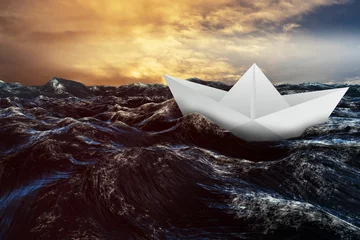 Gardinen Paper boat floating on the sea © vectorfusionart