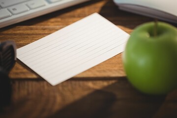 Keyboard and mouse by apple on table