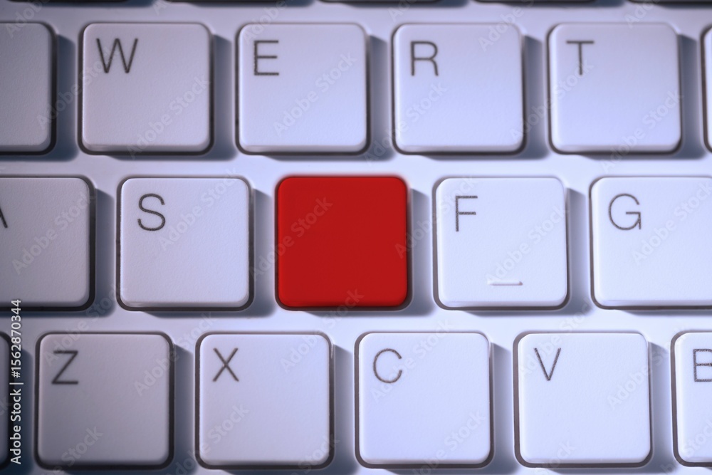 Fototapete digital composite of red key on keyboard