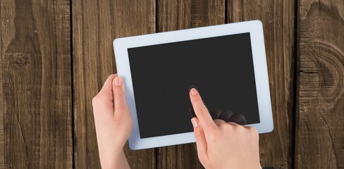 Cropped of hand touching digital tablet