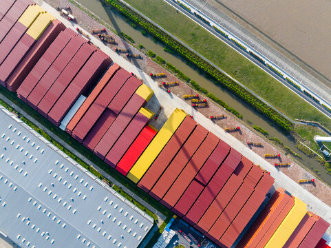 Aerial View of Neatly Arranged Shipping Containers and Parked Containe