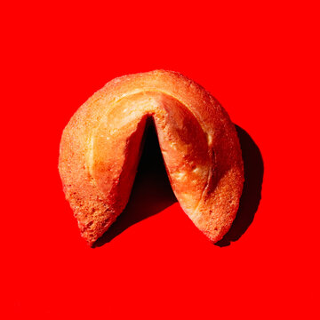 fortune cookie on a bright red background