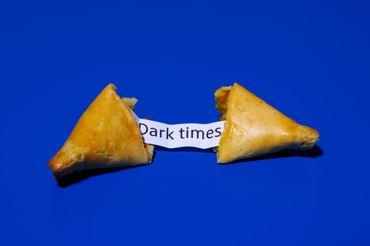 fortune cookie with the message dark times
