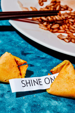 open fortune cookie with the message shine on