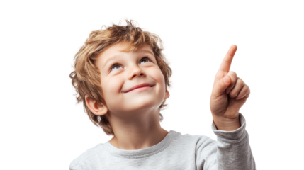Cheerful boy pointing upward with a smile, showcasing curiosity and excitement against a white isolate background.
