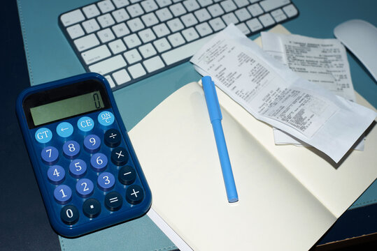 Сalculator and receipts on working table
