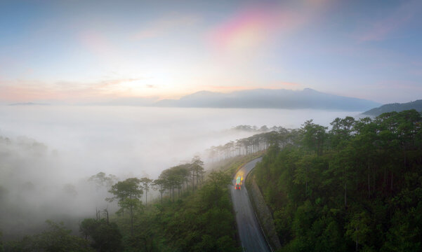 Misty morning road through serene hills in Lac Duong, Lam Dong, 