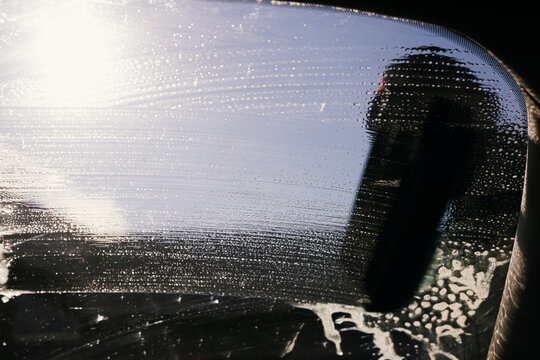 Textural View of Cleaning a Car Windshield