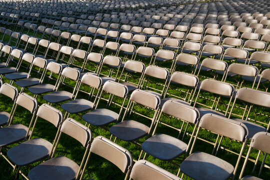Rows of empty chairs at college graduation ceremony