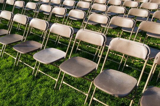Rows of empty chairs at college graduation ceremony