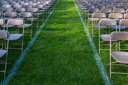 Rows of empty chairs at college graduation ceremony