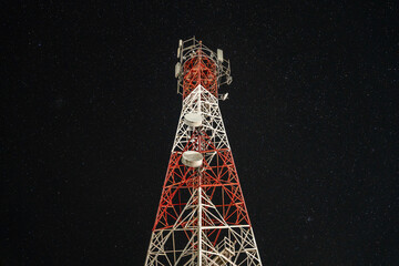 Telecommunication Tower at Night Under Starry Sky in Thailand – Wireless Network and Technology...