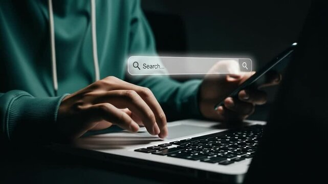 Person using smartphone with ai chatbot interface on screen near laptop and tablet on desk top view