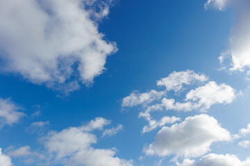 Bright Blue Sky with Scattered Cumulus Clouds