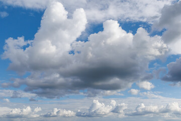 Dramatic sky with fluffy and dark clouds