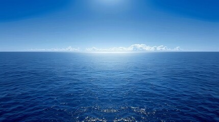 Fototapeta premium Gentle ocean waves rolling over a deep blue water surface under a serene clear sky above