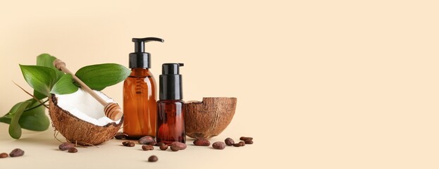 Different cosmetic products, coconut and coffee beans on beige background with space for text