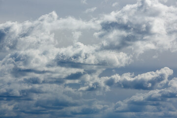 Dramatic cloudy sky with sunlight filtering through