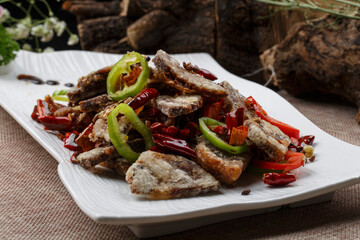 Steamed Enoki Mushrooms with Chili Sauce and Chopped Peppers in a Rectangular White Porcelain Plate