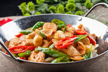 Stainless steel pot with green pepper and garlic pork intestines