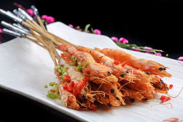 Kung Pao large shrimps on a white porcelain plate