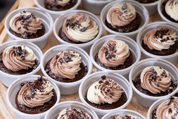 chocolate cupcakes on wooden plate in wedding party reception