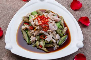 Spicy fried eggplant in a square white porcelain plate