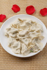 Fresh seafood dumplings on a white porcelain plate