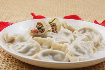 Fresh seafood dumplings on a white porcelain plate