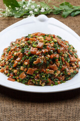 Black iron pot with seafood and fish pancakes