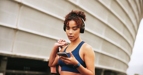 Phone, fitness and woman in city with music for exercise, streaming podcast or radio online....