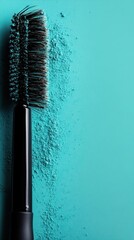 Teal cosmetic brush with loose powder