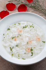 White round porcelain soup bowl with mullet, shrimp and egg drop soup