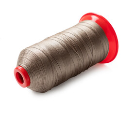 spool of sewing thread close up on white background