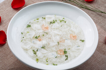 White round porcelain soup bowl with mullet, shrimp and egg drop soup