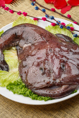 Deep sea manta ray on a white oval porcelain plate