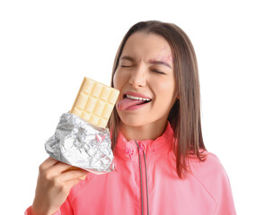 Young woman with white chocolate bar on light background