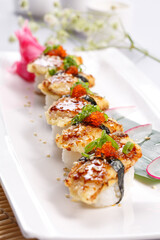 Eel tempura sushi on a sushi curtain