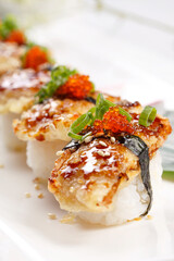 Eel tempura sushi on a sushi curtain