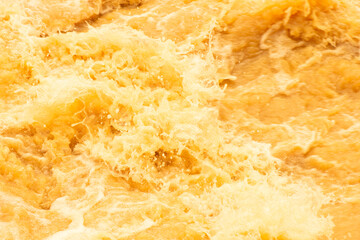 Orange water with ripples on the surface. Defocus blurred transparent white colored clear calm...